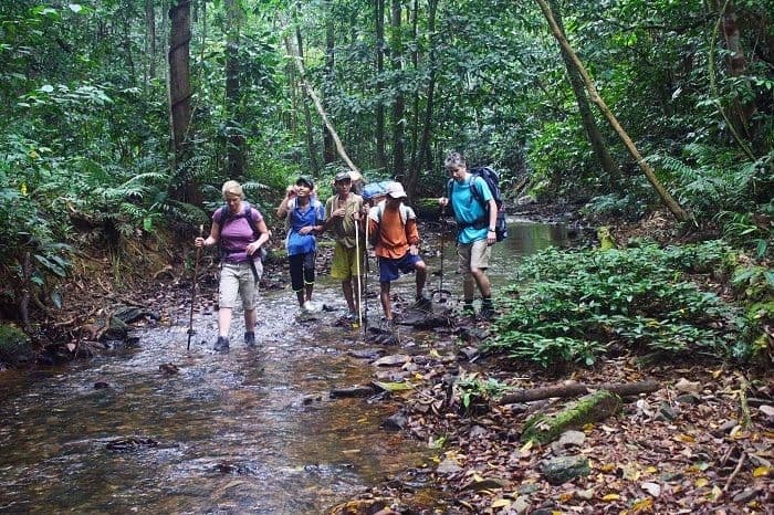 Wading stream to Lao Cai in a trekking trip